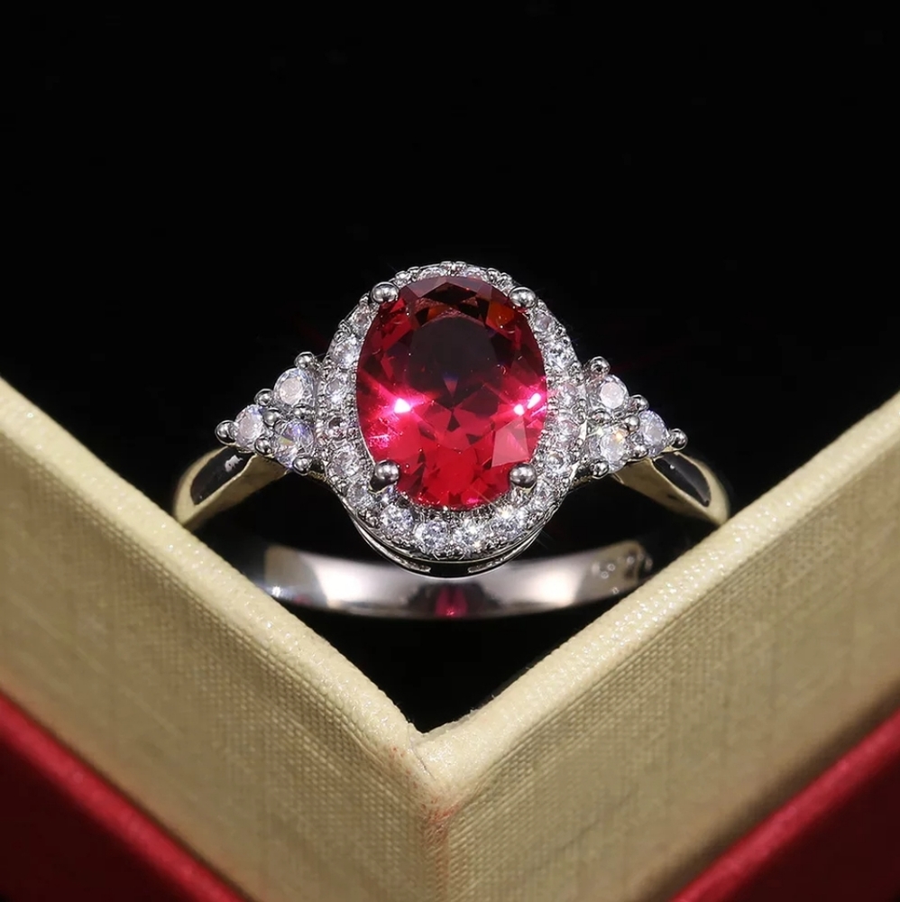 Oval cut Magenta crystal and zirconia cubec Ring
